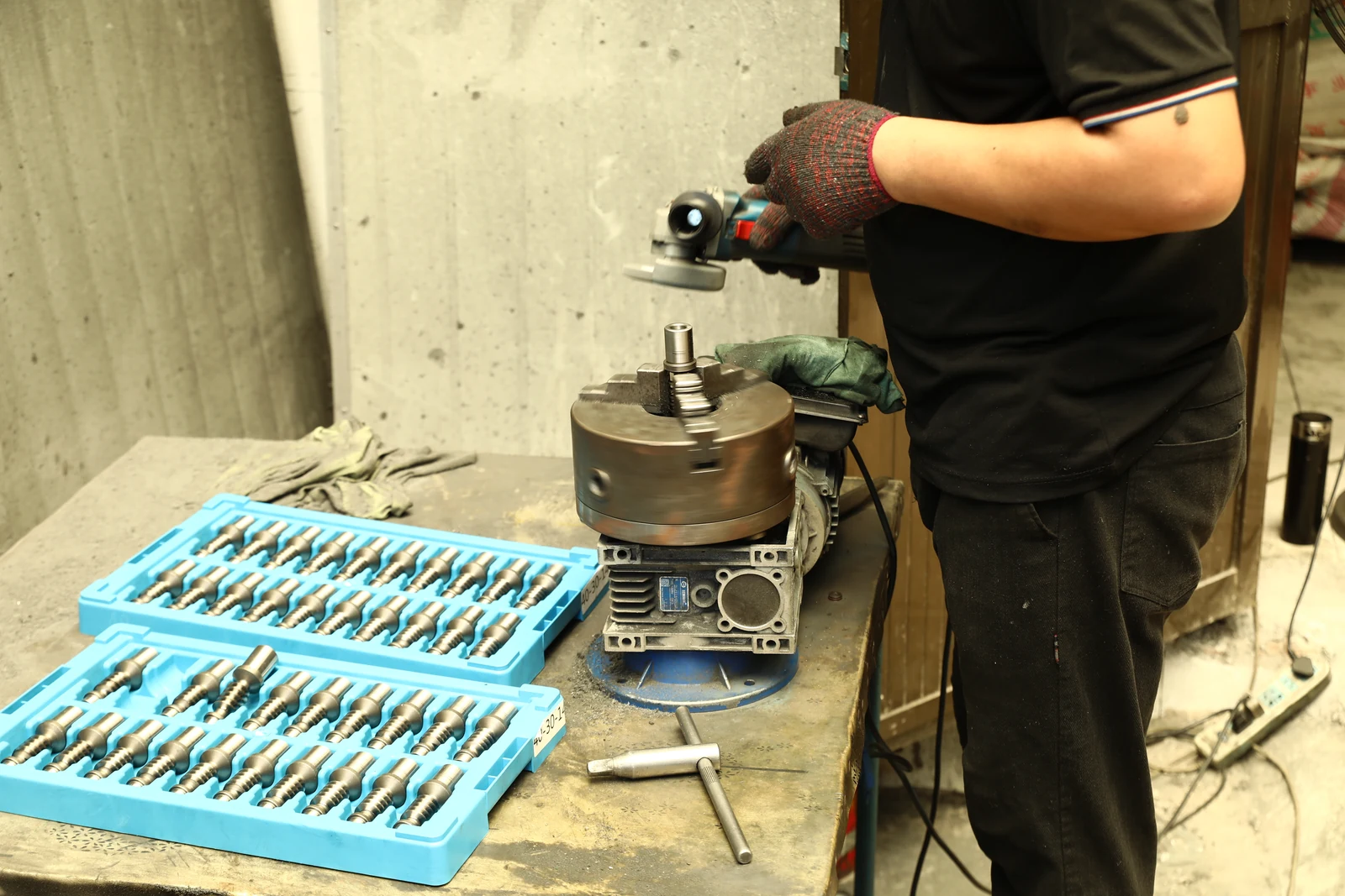 Technician finishing worm shafts for SMK worm gear reducers